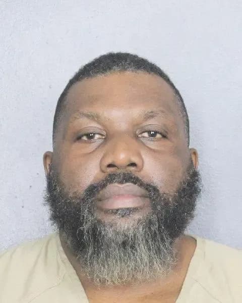 Former Haitian police officer charged with smuggling guns to Haiti from US