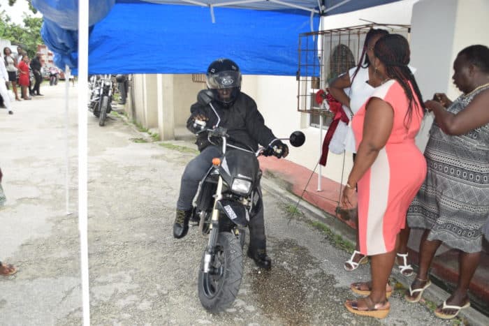Woman’s body perched on motorcycle for funeral