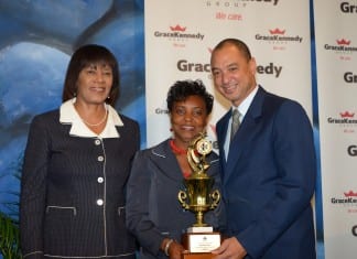 GK Heather Little White household worker of the year making dreams come true (From left) Prime Minister Portia Simpson-miller, Rosetta Steer and GraceKennedy Group CEP Don Wehby