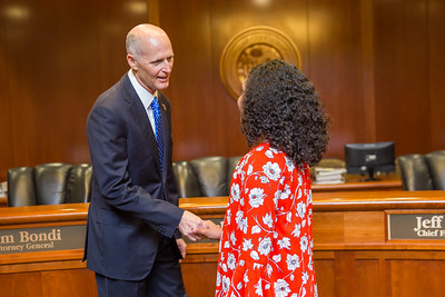 Rick Scott shakes hands with a visitor- Caribbean News Weekly