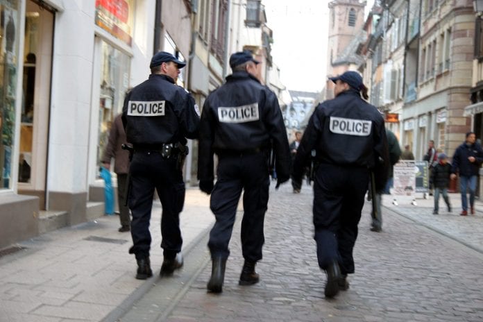 Police walking in the street - Caribbean National Weekly News