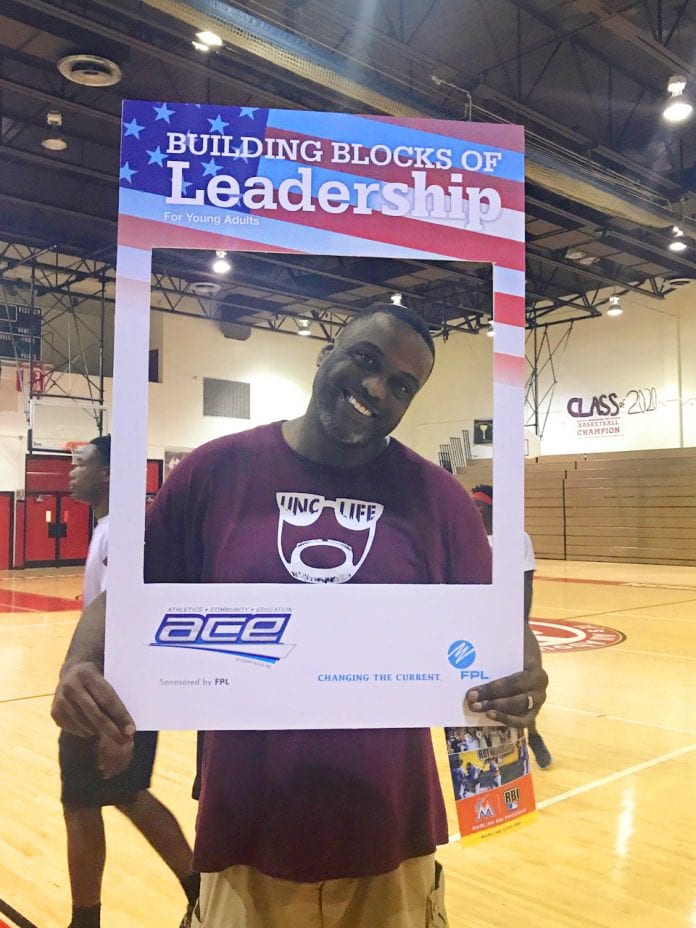NFL PLayer poses for Student Aces Program in Miami Dade - Caribbean National Weekly News