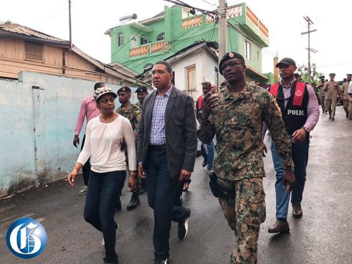 Jamaica Prime Minister tours Zoso a town riddled with illegal guns and crime - Caribbean National Weekly News