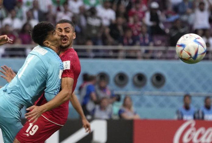 Iran goalkeeper clashes heads with teammate at World Cup