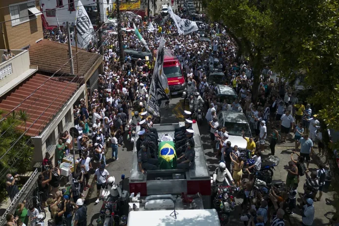 Pelé buried at cemetery in Brazilian city he made famous