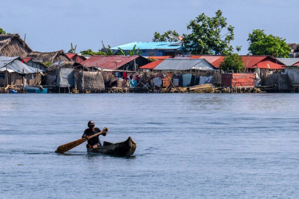 A Guna indigenous man paddles his canoe. The indigenous community on Carti Sugtupu, off Panama’s north coast, lives off fishing, the harvesting of starchy crops like cassava and plantain, traditional textile production and a bit of tourism. 