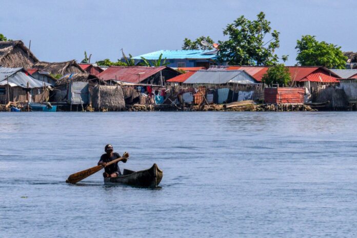A Guna indigenous man paddles his canoe. The indigenous community on Carti Sugtupu, off Panama’s north coast, lives off fishing, the harvesting of starchy crops like cassava and plantain, traditional textile production and a bit of tourism.