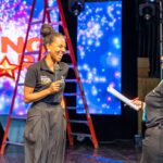 Terri-Karelle shares a laugh with her producer Sharon Schroeter during her final technical rehearsal for the 19th season of Digicel Rising Stars