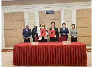 Dominica’s capital Roseau twins with two Chinese cities Minister of Housing and Urban Development Melissa Poponne-Skerrit (left) and Vice Governor of Shandong Province, Chen Ping following the signing of an MOU that twinned Roseau and Jining City.