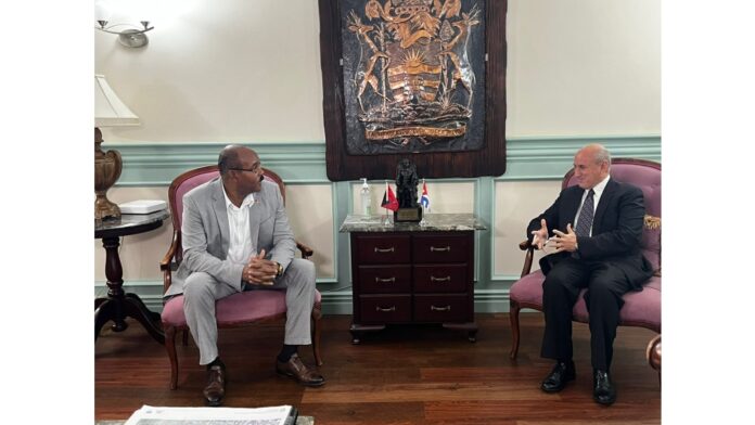 Cuba’s new Ambassador to Antigua and Barbuda, Sergio Manuel Matinez Gonzalez (right) and Prime Minister Gaston Browne.