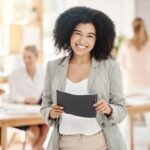 portrait-happy-black-woman-smile-team-planning-meeting-work-business-woman-office-with-staff-as-they-discuss-innovative-plans-collaboration-strategy-corporate-office_590464-97997