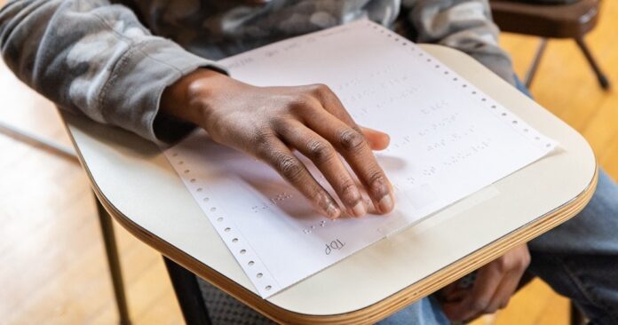 young_person_reading_ braille