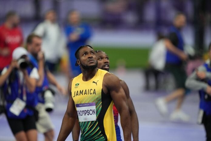 Kishane Thompson reacts at the end of the race.