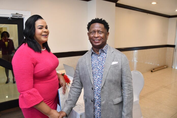 Gary Williams, COJO Founder (right) greets Laurette Adams-Thomas, CEO of the Child Protection & Family Services Agency (CPFSA) during last year's COJO Scholarship Awards Luncheon at the Jamaica Pegasus Hotel
