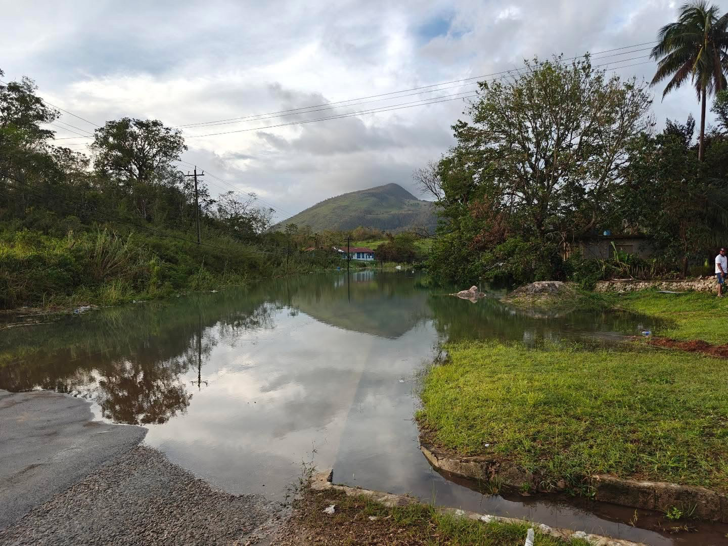 Rising waters threaten homes along Content main road in Williamsfield, Manchester