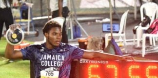 Blue wave builds! Jamaica College seize control while records shatter at Champs