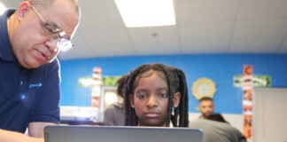 Coca-Cola Beverages Florida donates laptops to Miramar students at Afro-Carib Festival