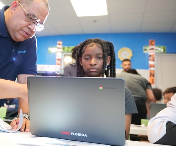 Coca-Cola Beverages Florida donates laptops to Miramar students at Afro-Carib Festival